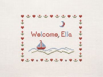 A sample card front in the style Cross-stitch sampler.